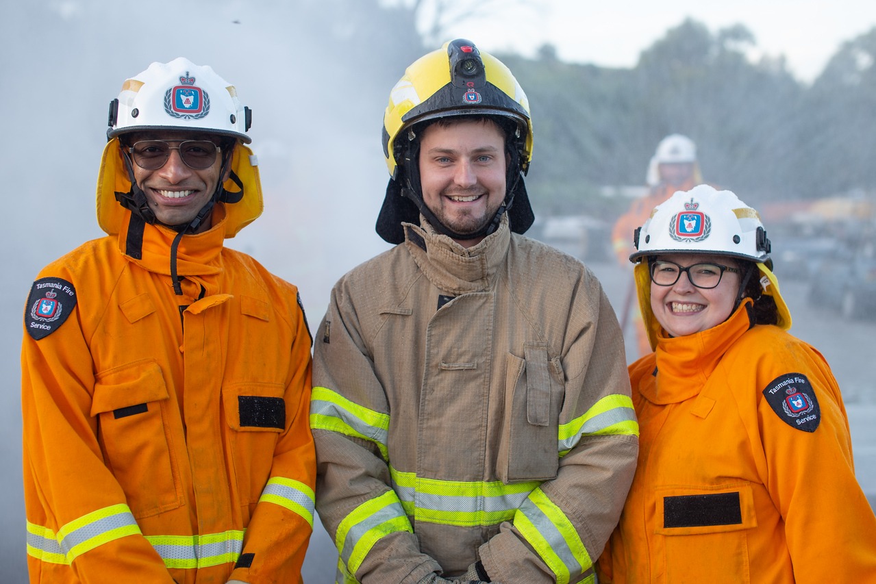 Three Tasmania Fire Service volunteers facing the camera
